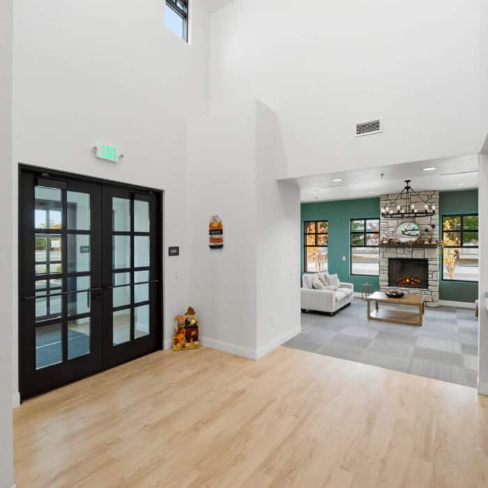 Front entry doors with the waiting room beyond