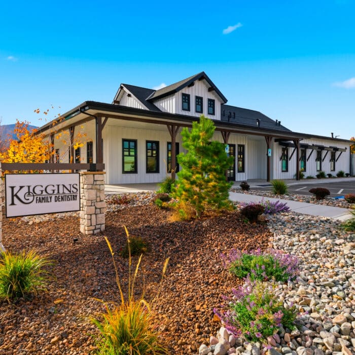 The office with the Kiggins sign and autumn landscaping